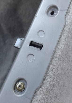 the hole that needs the correct screw to match the others.