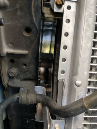 Here you can see how the "snout" side of the plenum fits in the space between the frame rail and radiator assembly, so it can direct cold air from in front of the radiator into the air filter