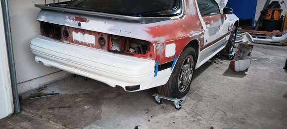 Rear bumper with some black tape where the crack is. 