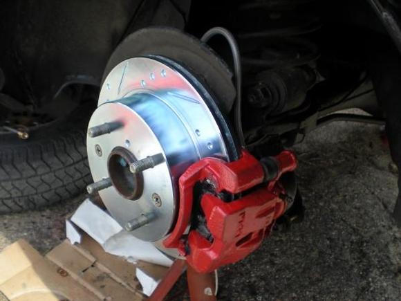 brake lab slotted and drilled rotors with stainless steel lines all around and painted calipers with ceramic brake pads