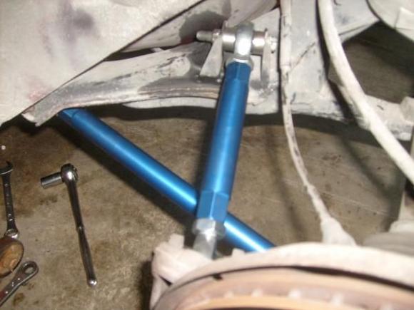 Rotary performance adjustable toe rods and trailing arms with solid mounts pre-alignment.  Before I installed these I couldn't get traction in the first three gears.  Now the tires still break loose in first, but there's no wheel hop and it stays in a straight line till it hooks, all other gears traction stays tight.