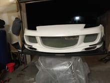 That is the front bumper with the carbon fiber lin and canards