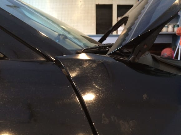 right fender. occurs when hood is pushed up to the windshield