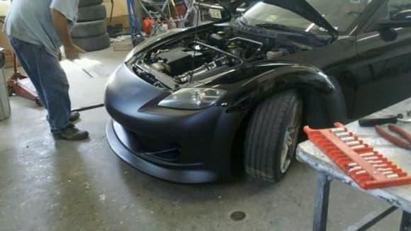 Test fitting the new front end after the car accident
