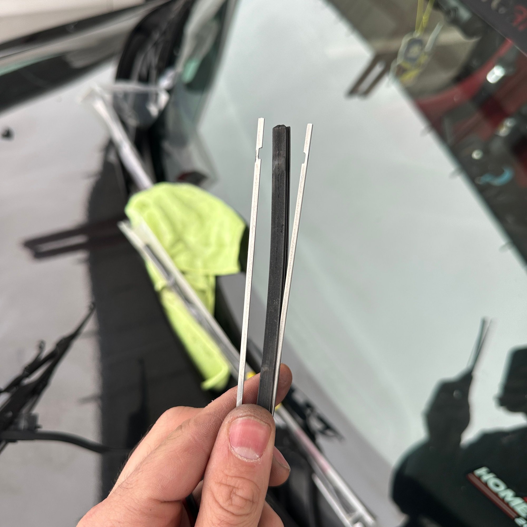 Inside the old wiper, there are two metal strips. These strips give the blade tension. You will be swapping them into the new insert.