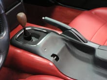 Customized center console for more elbow room plus custom wood shifter knob