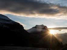 Logan Pass - Sunrise peaking around mountain