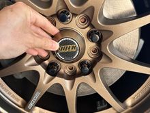 ...the bronze is a shade off but matches the anodization on the outer rim better than the powder coated spokes; looks pretty good to me. 