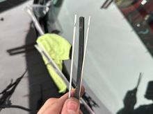 Inside the old wiper, there are two metal strips. These strips give the blade tension. You will be swapping them into the new insert.