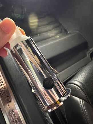 Next to the service hold to replace the bulb is the housing tab. You don't need to mess with it. 