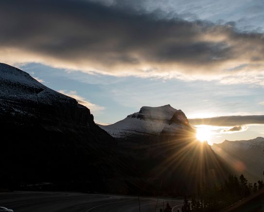 Logan Pass - Sunrise peaking around mountain