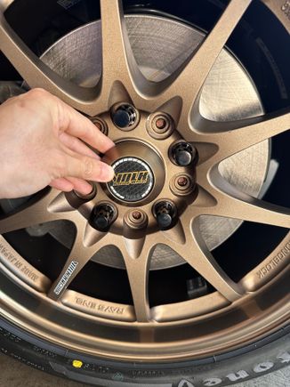 ...the bronze is a shade off but matches the anodization on the outer rim better than the powder coated spokes; looks pretty good to me. 