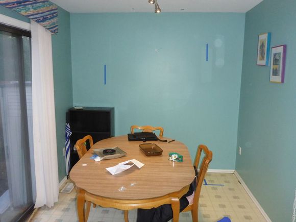 Empty!   The blue lines are to mark out some new things going along that wall.   That table was a wedding gift from my aunt and uncle... TO MY PARENTS!!!  in 1960!  I don't think it owes the family anything and was just low on the list of things to replace.   Bye bye table!