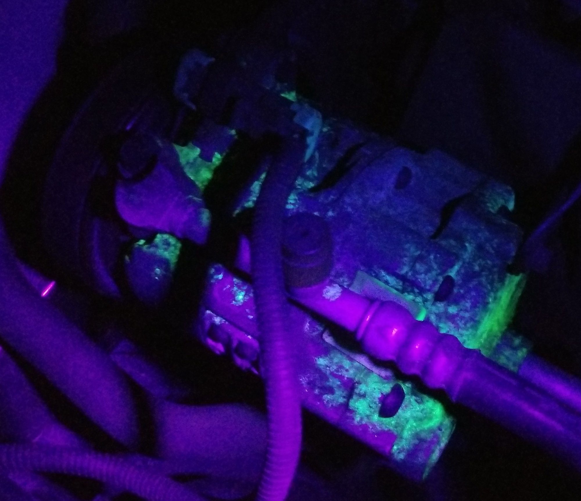A black light reveals the compressor is leaking, quite severely, and may have additional internal problems.