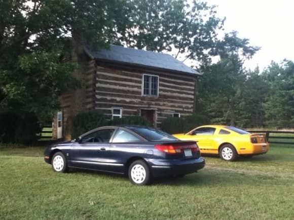 My Saturn and my uncle's Mustang out at the cabin.