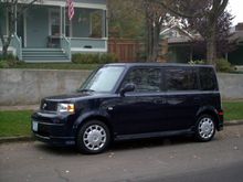 Kathleen's blue xB in front of our house.