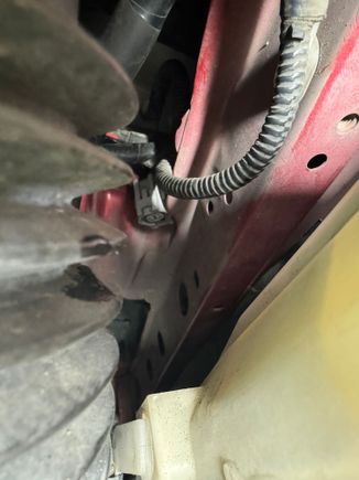 Frame rail next to coolant reservoir 