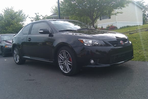 Tinted windows, painted calipers, red scion logo