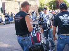 Me and my Paps looking at his bike.... He got a little to crazy and scorched his piston's from the parade....