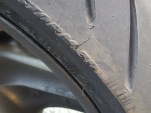 I put 3 - 4000 kms on this new tire before i started to notice slight wear. I thought it was an aftermarket metal chain guard I had installed, so I switched it back to the stock plastic one.