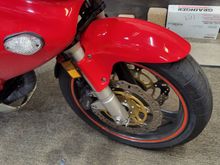 Twin LED driving lights off for replacement, mounting tubes project out of daux intake nostrils. 