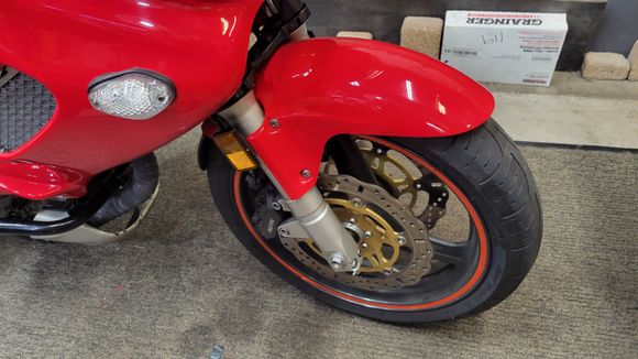 Twin LED driving lights off for replacement, mounting tubes project out of daux intake nostrils. 
