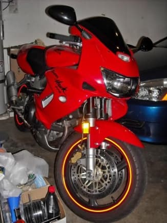 The bike with new Proton LED turn signals, Double Bubble windscreen, and red reflective tape on the wheels.