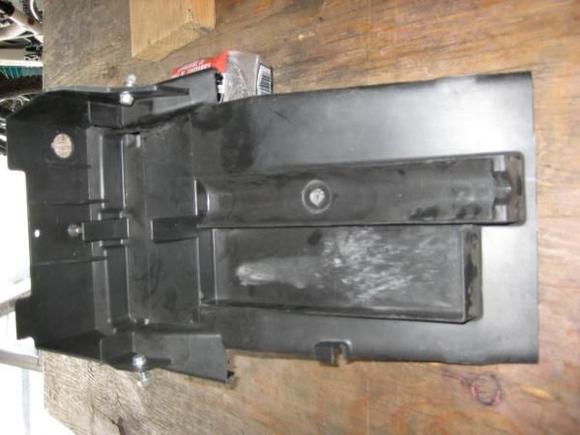 removed portion of seat undertray from front