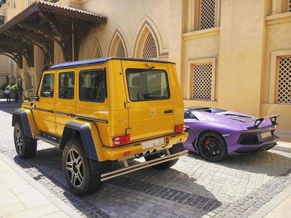 Solar beam yellow Mercedes-Benz G500 AMG 4×4² and matte purple Lamborghini Aventador Roadster. Both supercars owned from Saudi.