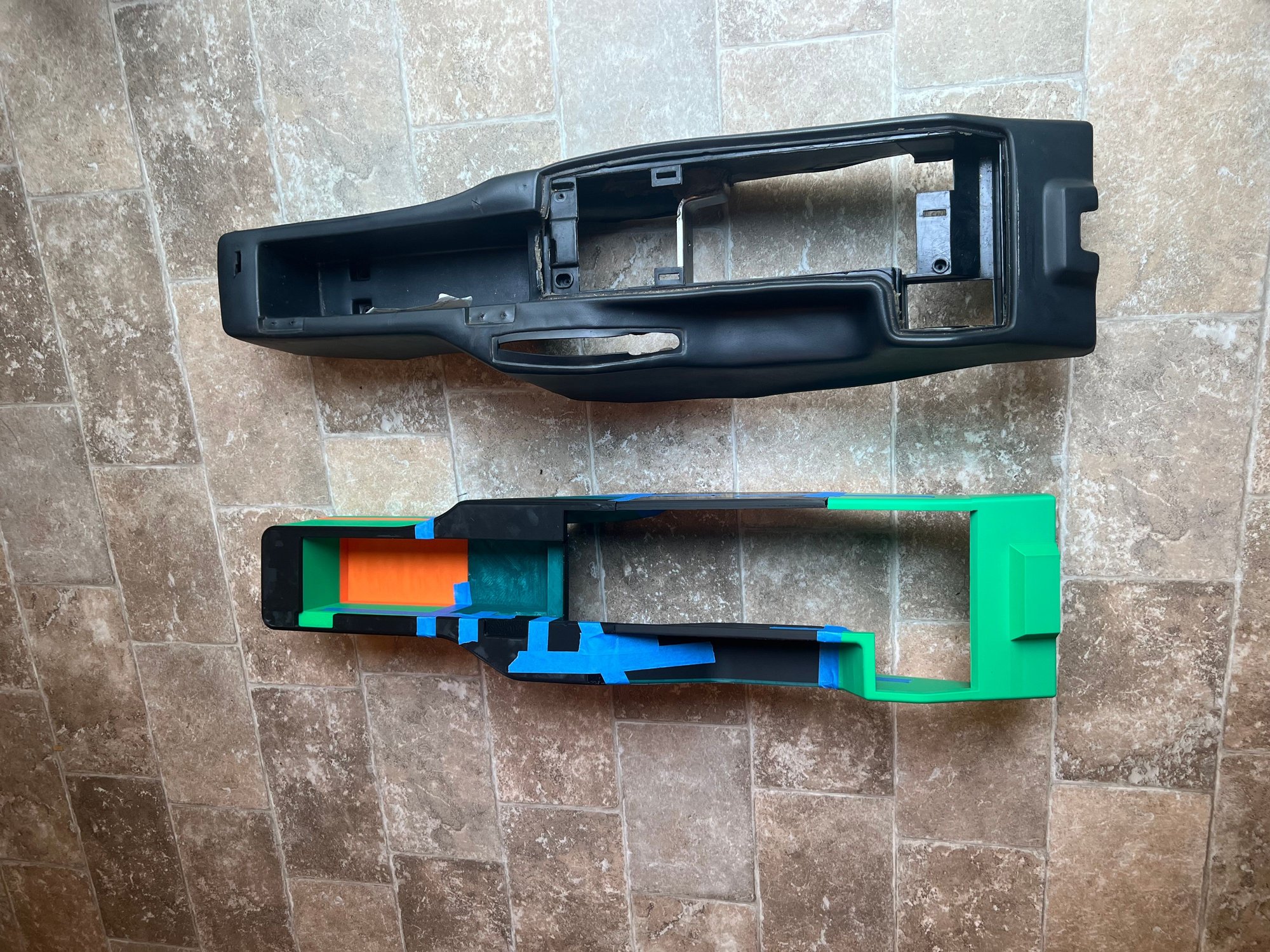 Early prototype next to original center console. Top View.