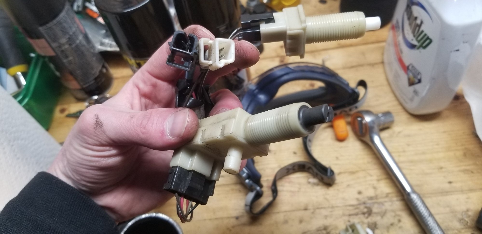 Cruise control switch is that one at the top, ignore the other wires Im holding, didnt know what was what at this point