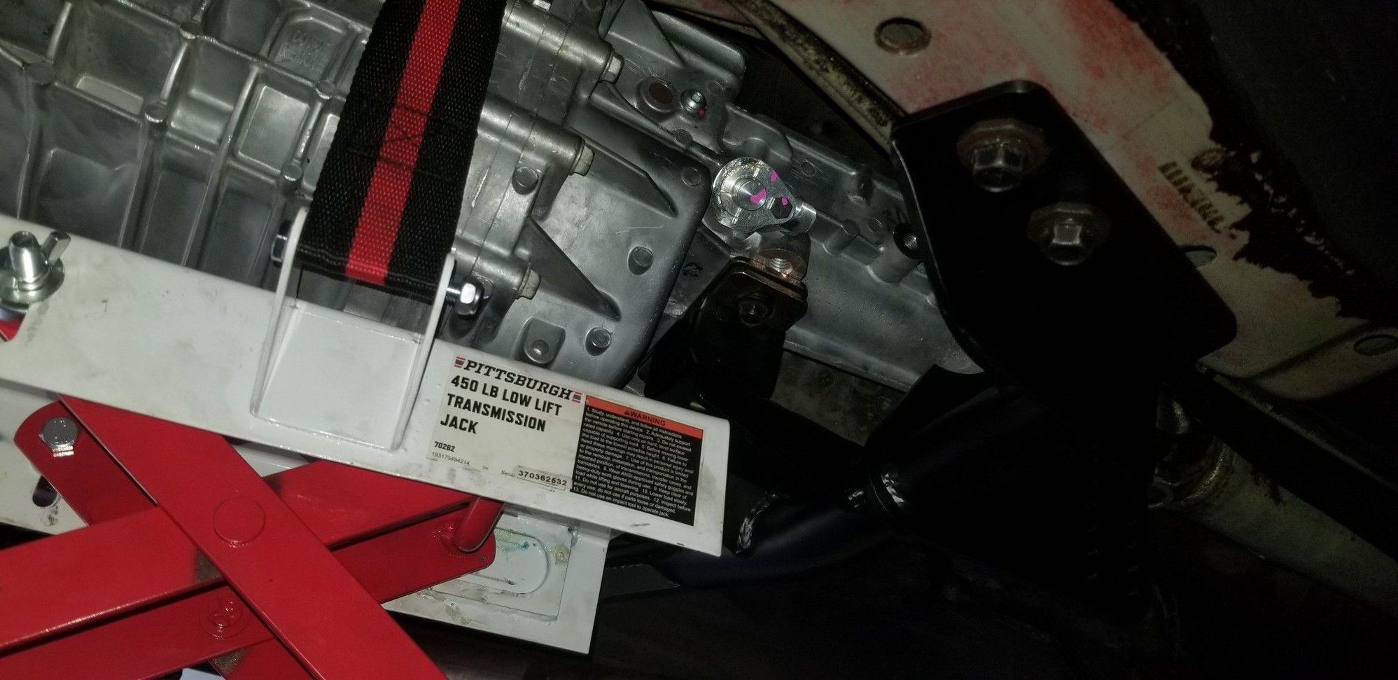 Didnt get a pic of the crossmember installation on the final trans install, so here it is from my test fit, when I marked the shifter location.  MAKE SURE THE TORQUE ARM IS ON THE OUTSIDE OF THE MOUNT, towards the trans tunnel!  