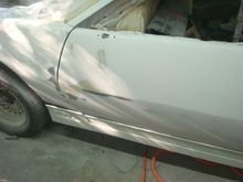 Sanded the bondo spot on the front and then blocked door to fender.