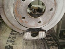 Mocking the rotor to caliper back up on the bench.