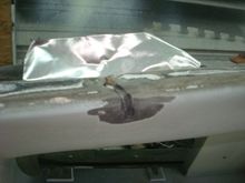 Using metal tape as a backer due to the hole and size of the tear.
