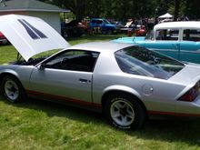 Car show yesterday in Gowrie, IA. It was so hot....just miserable. Then to make matters worse, i got caught in rain on the way home...NOT HAPPY. For whatever reason, my hood blackouts look all weird in this pic.....they are just the factory ones...its just a weird reflection