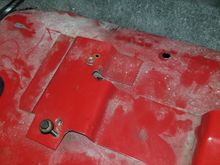Here, you can see where the hole from the rear pass side bolt lined up, and the pilot hole was drilled 