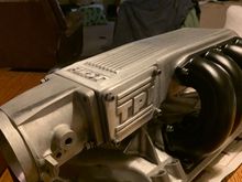 Satin finish on plenum. Runners powder coated in Matte River Black. Manifold natural glass beaded aluminum. Rails and injectors not shown