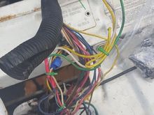 This was the mess in front of the radiator spliced into the headlight wiring. I bought another headlight harness and a brand new isolation relay so i can get the light working properly.