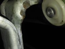 What my front window stop looks like. There is no contact between the plastic circle and the rubber tip on the "back metal piece"