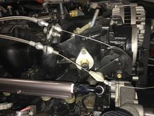 Here is what I did. Drilled the bracket for more than 1 hole so I had some adjustment/fine tuning. I'm using a lokar 2004R TV cable which has its own ball stud/bolt and makes it super easy... Just need a hole to bolt the ball stud down. So far it's worked great, if anything it's alittle on the aggressive side. But I tried to get the math right with the previous posts diagrams.