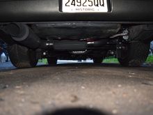 For those wondering what ground clearance was with SS long tubes, dual 3" into single 4" over axle with dual mufflers and lowered. I honestly couldn't scrape it if I wanted too lol