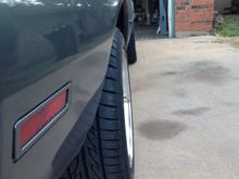 They won't fit any better than your current wheels do. This is how they fit on my stock width rear end.