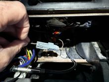 Brown wire w/ gray connector behind radio & heater-A/C control head (being removed)