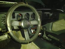 Inside is basically stock..switched 2 a camaro shift knob..sum bs pedals...aftermarket pioneer cd player..wrapped the cd fram in navy blue cloth..