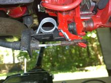 The little "hook" on this spring (13590527) doesn't interfere with the parking brake cable or eyelet.
