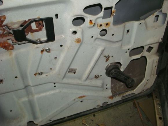 Drivers window regulator riveted back in place.
