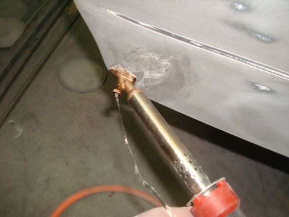You feed the urethane rod through the hole in the foot.