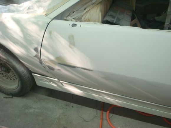 Sanded the bondo spot on the front and then blocked door to fender.