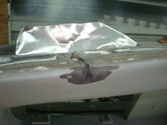 Using metal tape as a backer due to the hole and size of the tear.
